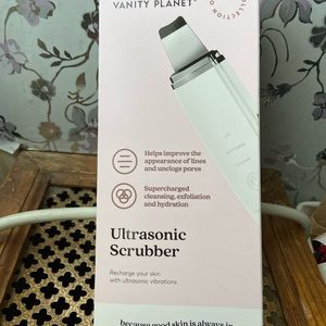 Vanity planet ultrasonic scrubber